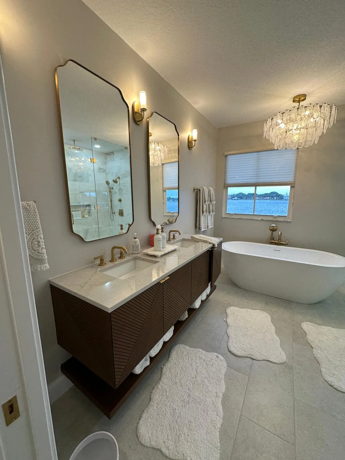 Bathroom remodel with a double vanity and freestanding tub in Port St Lucie, FL