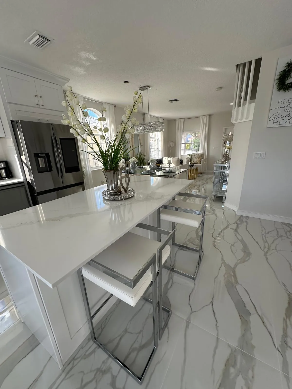 Kitchen island on a marble-look tile floor, kitchen remodeling in Port St Lucie, FL
