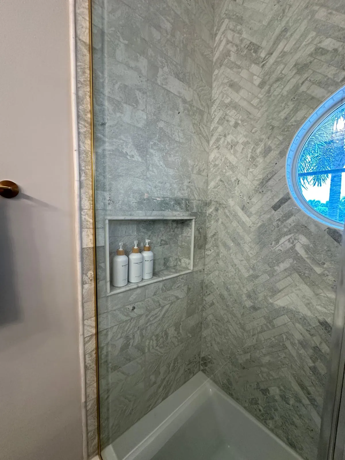 Recessed shower niche in herringbone tile, bathroom remodel in Port St Lucie, FL