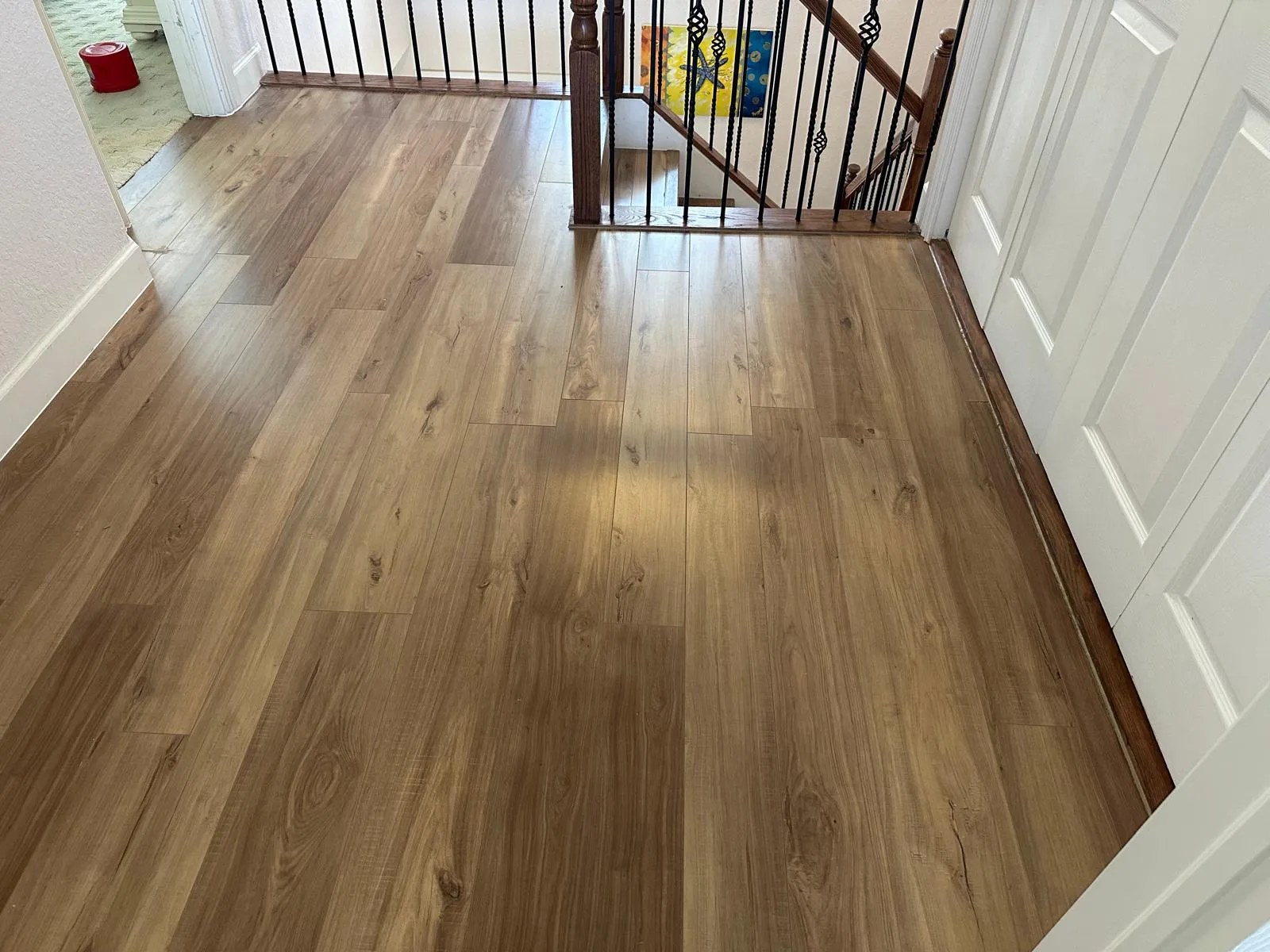 Wood-look flooring in an upper hallway, flooring installation in Port St Lucie, FL
