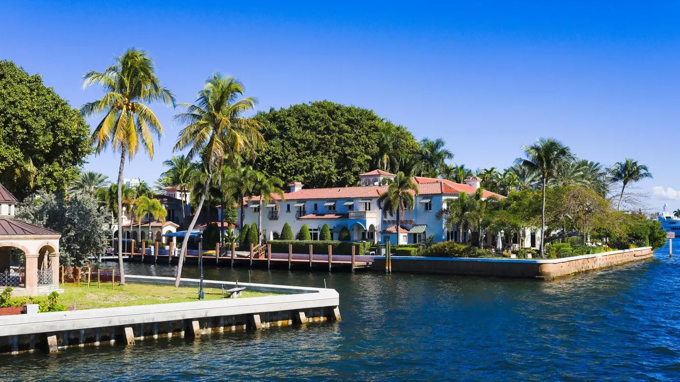 Canal-side homes with palm trees, home remodeling in Stuart, FL